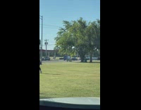 Woman in black tank top danced on the field park