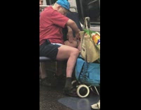 Old man cuts his thigh hairs with pair of scissors on the subway