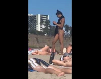 Girl lays nude cloth covers body beach 