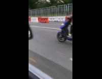 Guy blue scooter computer monitor by feet