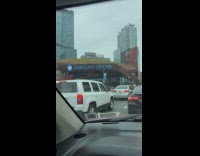 Man sitting on barclays center roof 
