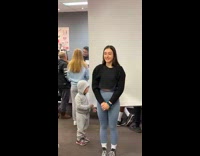 Little baby stops to look at girl taking picture 