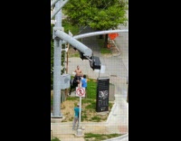 Shirtless man sit black cow statue box