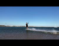 Guy kitesurfs slo mo 