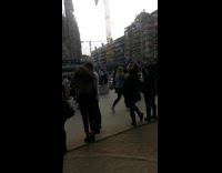 Two young boys pose la sagrada familia