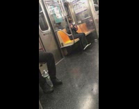 Lady two purple dumbbells sits exercises subway