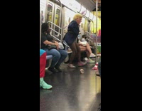 Trump costume mask girl white bra subway 