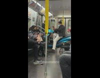 Man sitting on a scooter on the subway train