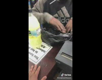 Man pours lemonade into plastic bag and drinks it