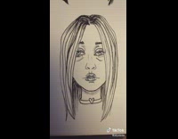 White paper notebook with sketches of peoples faces