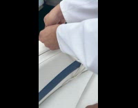 Man shows figure 8 knot on boat