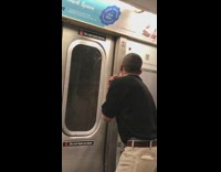 man in black shirt shaves on subway