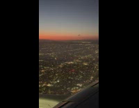 City and fireworks view from plane sunset