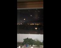 Timelapse of spider constructing web on door 