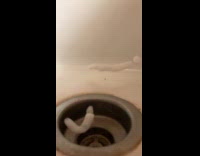 Soap foam floating on sink 