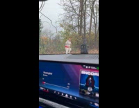 Woman dances front of the garbage bin