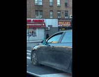 Car with hand mirror used as side mirror