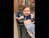 Baby confused on what to feel riding shopping cart 