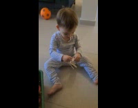 Dad tell toddler sit on small chair