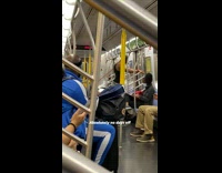 Guy works out arm with just the air on subway 