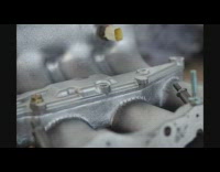 Stop motion guy assembles car parts 