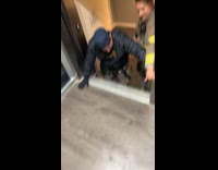 Man being rescued stuck at elevator