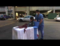 Girl turns in half body patient costume