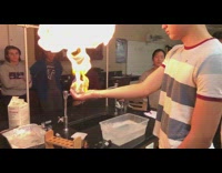Guy holds bubbles red lighter fire experiment 