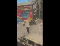 Woman lie down snowy sidewalk for picture