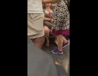 Woman with fan phone attachment cools down 