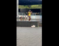 Man long hair wig wear headphones park