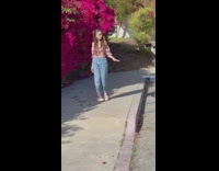 Girl twintails sing spin beside bougainvillea flowers