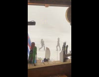 Collab IITW - Woman poses while snowstorm near mountain cabin