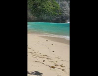 Collab IITW - Woman Poses for Photoshoot on one Side of Beach while Man is on the Other