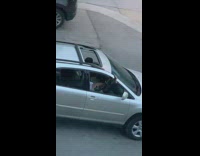 Girl long black boots outside car window