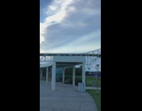 Girl grey shirt white bridge light post