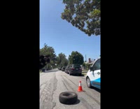 Collab WeirdM - Man changes wheel tire on the street