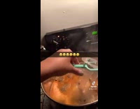 Girl uses plastic speculum to stir food 