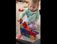 Little girl takes down toy house