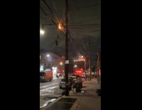 Utility pole electric cables on fire night