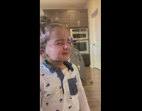 Little boy fake cries and peeks to see if adult is paying attention