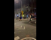 Guys dressed as Spartans fights on road