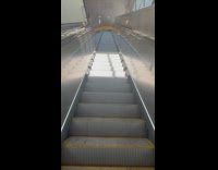 Sunlight from the window moves on the escalator