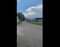 Guy rides motorcycle up ramp jumps in water