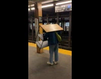 Collab Subway Creatures - Man hunched over carry shelf subway station