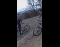 Guy on bicycle almost runs into pole 