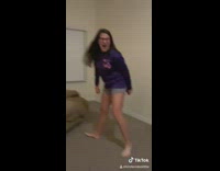 Girl catches red disk with butt cheeks