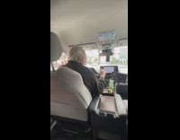 Elderly Cab Driver Sings along with Radio Music