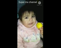 Girl baby eat lemon funny face reaction