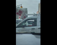 Guy sitting in traffic practicing the drums on his steering wheel